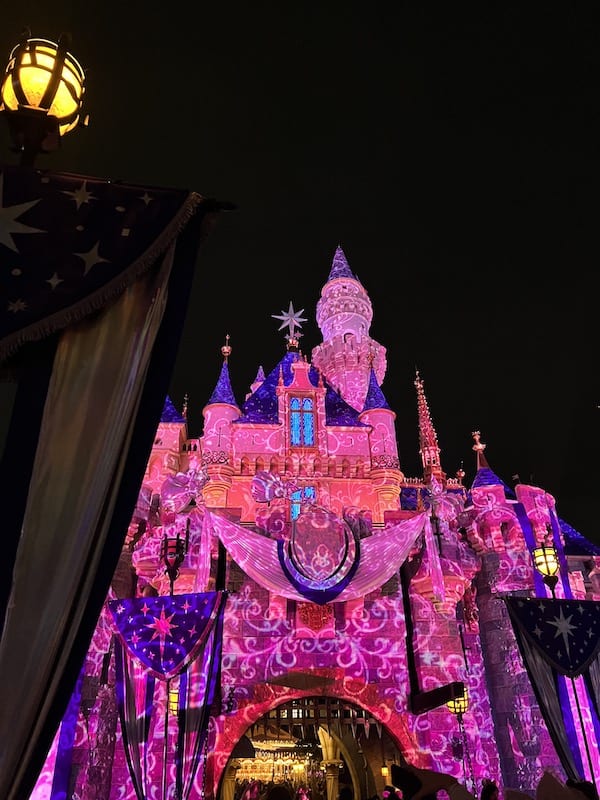 Disney after dark princess nite castle overlay (pink and purple lights projected on castle)